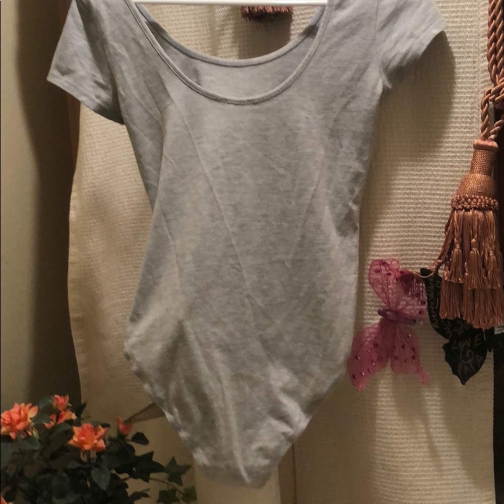 Timing on piece shirt. Snap bottom